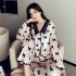 Otoño invierno grueso traje de pijama de terciopelo dorado mujer dulce cuello de muñeca pijamas con estampado de lazo al por mayor