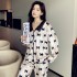 Otoño invierno grueso traje de pijama de terciopelo dorado mujer dulce cuello de muñeca pijamas con estampado de lazo al por mayor